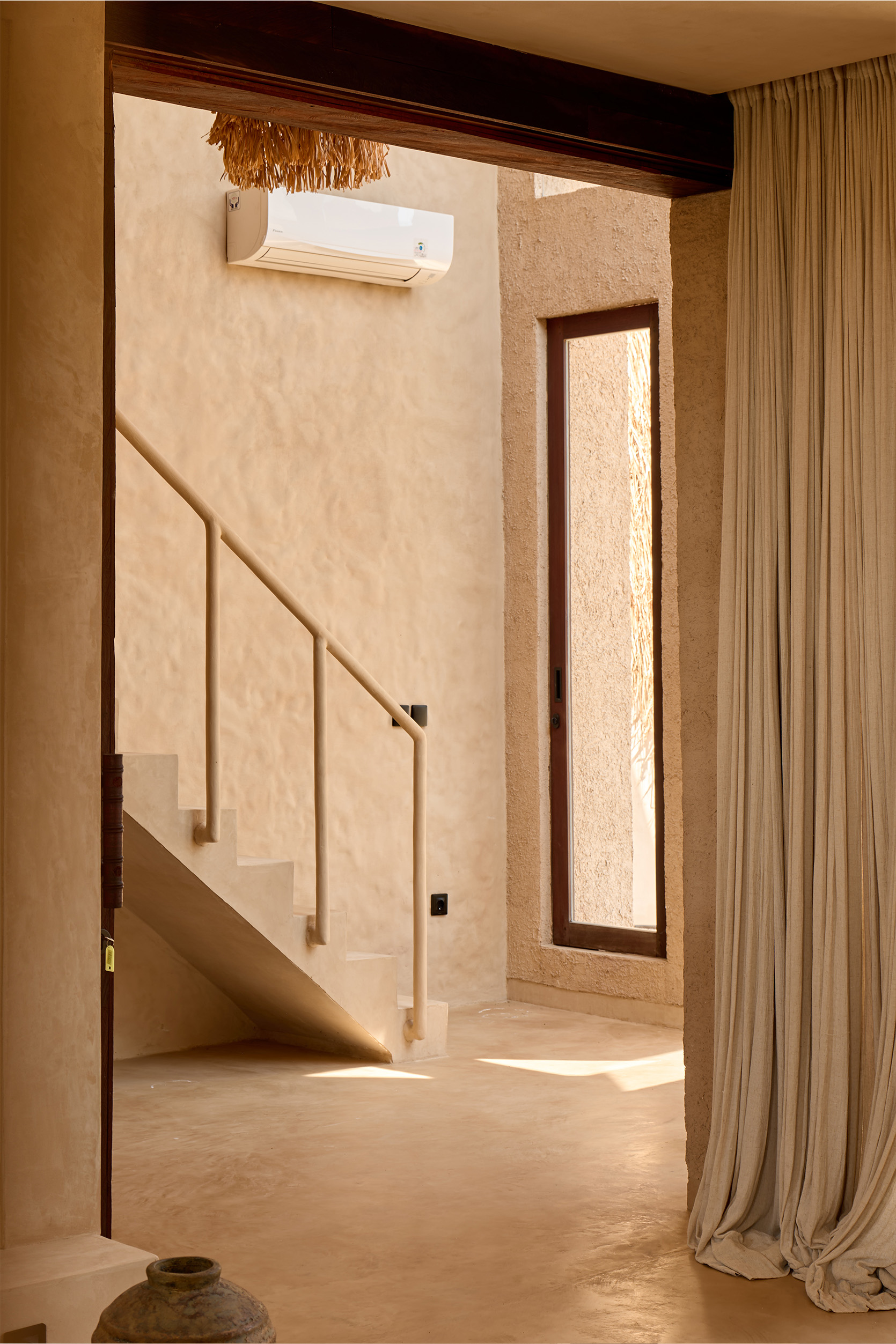 Breathable lime plaster wall finish in a Bali villa